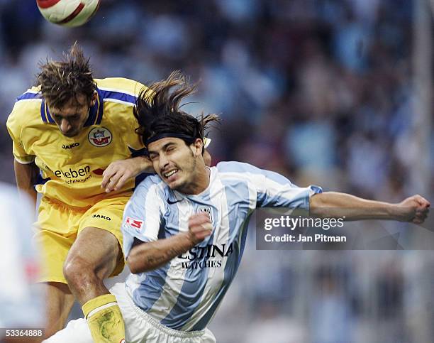 Rodrigo Costa of Munich challenges for a header with Marcel Schied of Rostock during the Second Bundesliga match between TSV 1860 Munich and FC Hansa...