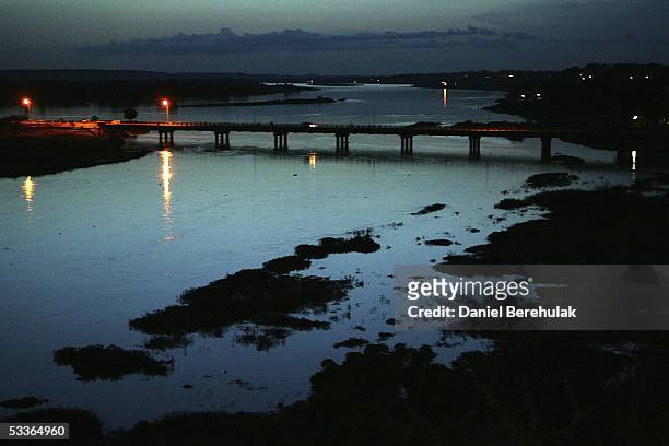 The river Niger stretches off into the distance as traffic passes over the Kennedy Bridge on August 12, 2005 Niamey, Nigeria. Niamey is the Capital...