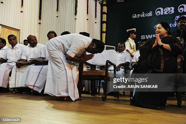 Jayalalithaa Jayaram, leader of All India Anna Dravida Munnetra Kazhagam , gestures as ministers take the oath during a swearing-in ceremony as chief...