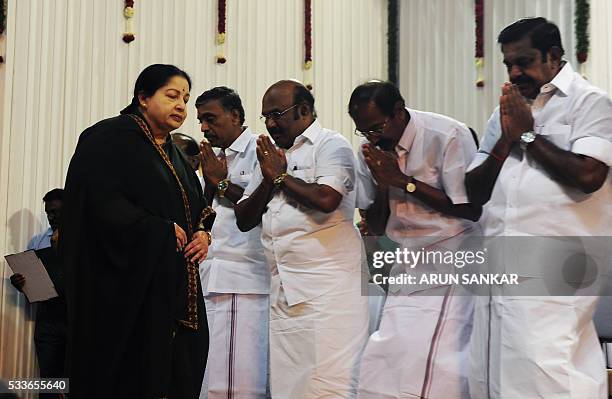 Jayalalithaa Jayaram, leader of All India Anna Dravida Munnetra Kazhagam , walks past state ministers after being sworn-in as the chief minister of...