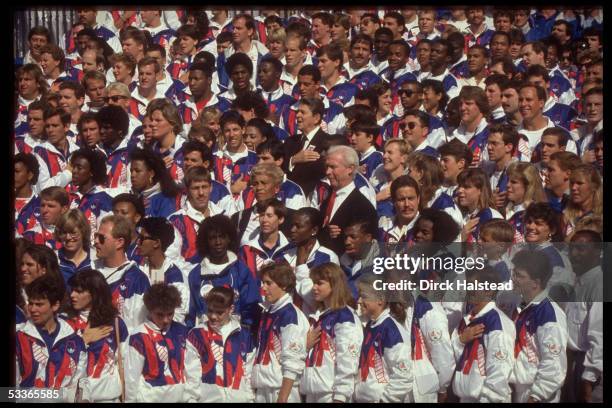 President Ronald Reagan flanked by Florence Griffith Joyner & probably Janet Evans with massed members of US Olympic team, probably during National...