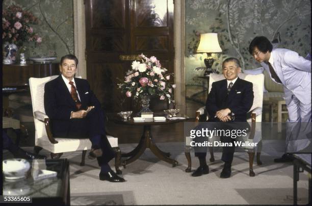 President Ronald with Reagan sitting with visiting Japanese Prime Minister Noboru Takeshita.
