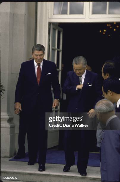 President Ronald with Reagan walking with visiting Japanese Prime Minister Noboru Takeshita.