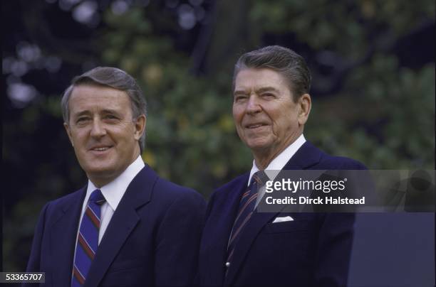 President Ronald with Reagan standing with Canada's Prime Minister Brian Mulroney outside the White House.