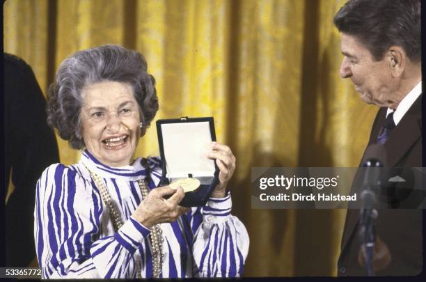 President Ronald with Reagan presenting Congressional Gold Medal to Mrs. Lyndon B. Johnson.