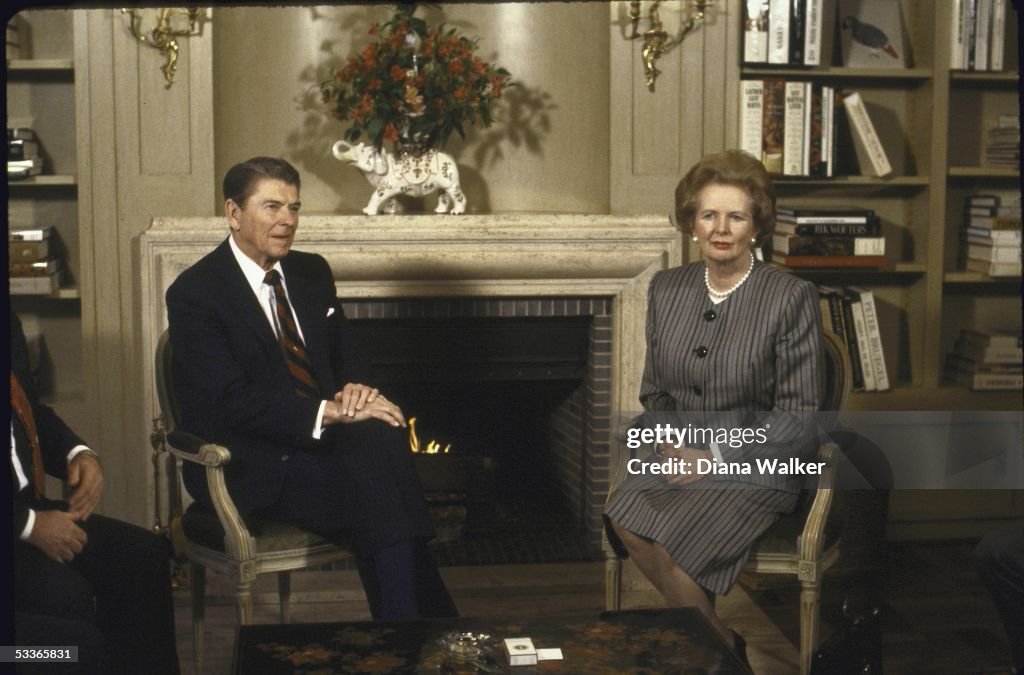 US President Ronald W. Reagan sitting with British