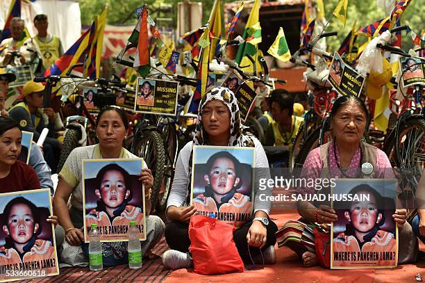 Tibetans living in-exile take part in a rally in New Delhi on May 23 at the conclusion of a cycle event from Dehradun in support of The Panchen Lama,...