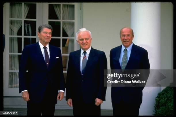 President Reagan with Soviet Foreign Minister Eduard Shevardnadze & State Secretary George Shultz in WH Rose Garden.