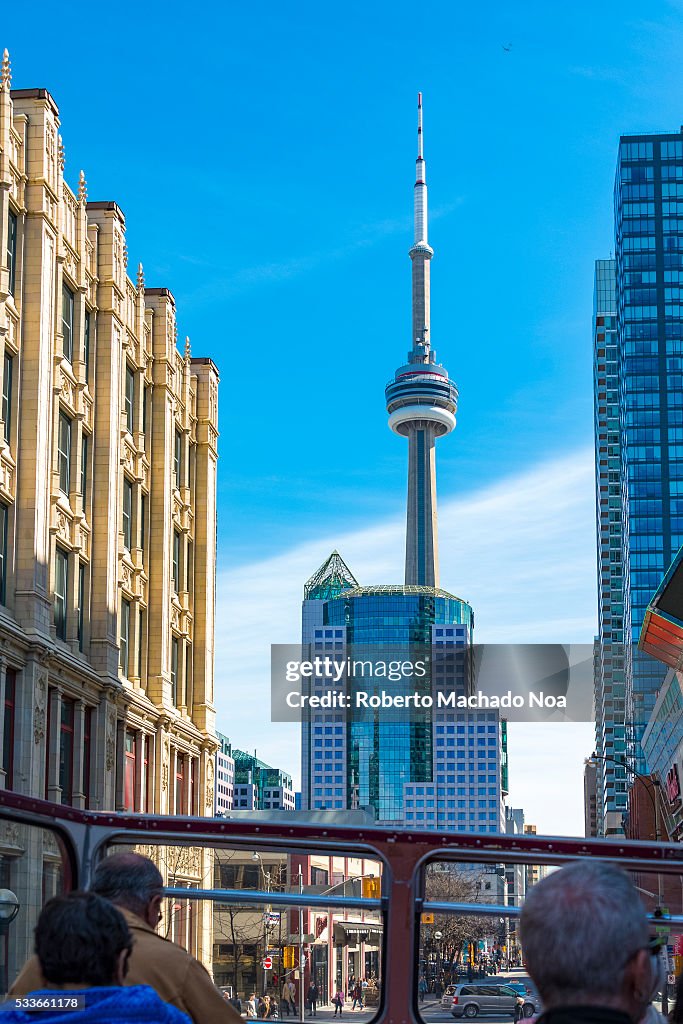 Toronto city skyline with CN Tower view from tourist bus.