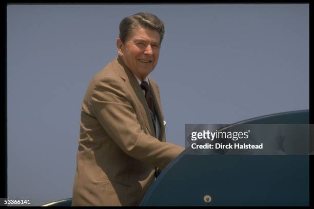 President Reagan poised before boarding Marine One helicopter, during visit to Cincinnati, OH.