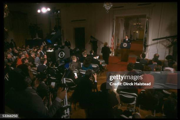 President Reagan holding news conference in WH East Room, taking question from UPI's Helen Thomas .