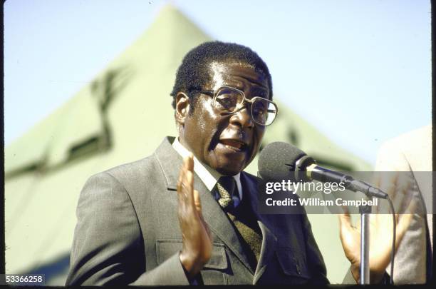 Of Zimbabwe Robert G. Mugabe in military uniform, forcefully gesturing while speaking at election rally at Tsholotsho.
