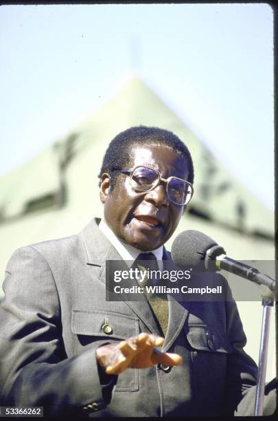 Of Zimbabwe Robert G. Mugabe in military uniform, forcefully gesturing while speaking at election rally at Tsholotsho.