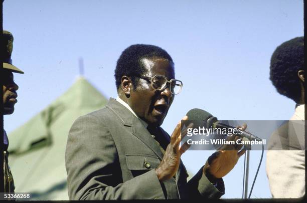 Of Zimbabwe Robert G. Mugabe in military uniform, forcefully gesturing while speaking at election rally at Tsholotsho.