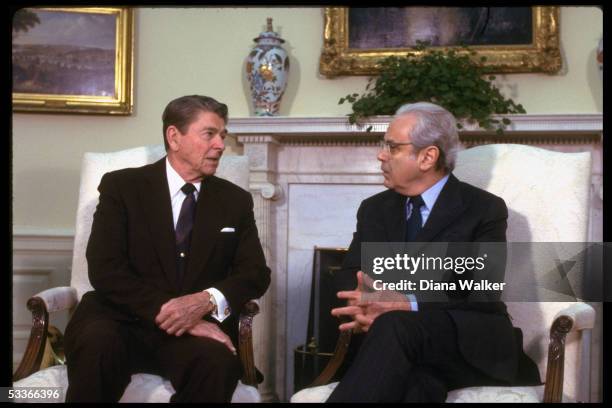 Secretary General Javier Perez de Cuellar meeting with President Reagan in WH Oval Office.