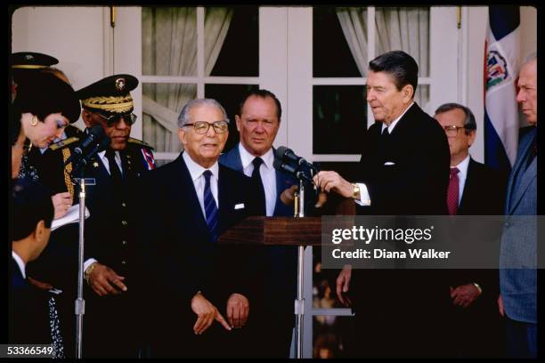 President Ronald Reagan with Dominican Republic President Joaquin Balaguer Ricardo & others including Howard Baker & George Shultz, at WH departure...