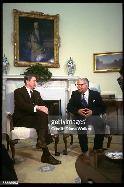 President Ronald Reagan with Dominican Republic President Joaquin Balaguer Ricardo in Oval Office, at WH.
