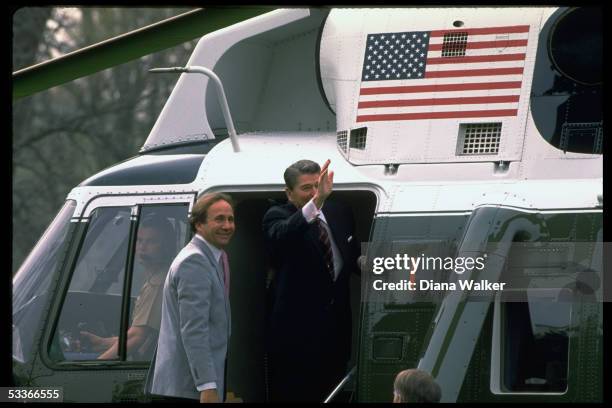 President Ronald Reagan with son Michael Reagan in doorway of Marine One, departing for California.