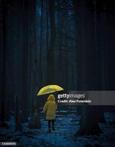 little girl in the dark forest - girl rain night stock pictures, royalty-free photos & images