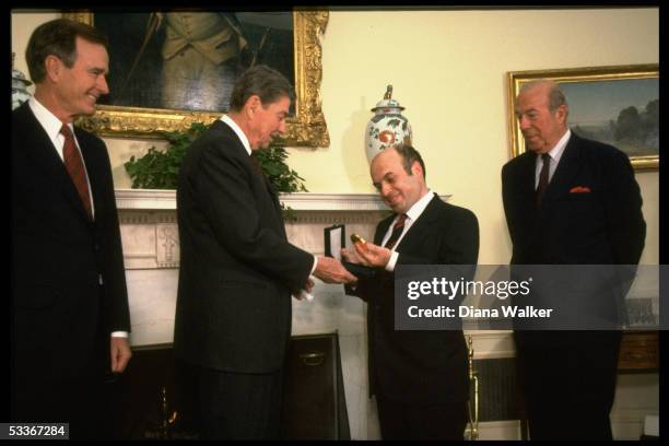 President Reagan presenting Soviet Jewish activist Natan Sharansky with Medal of Honor with VP Bush & State Secretary Shultz .