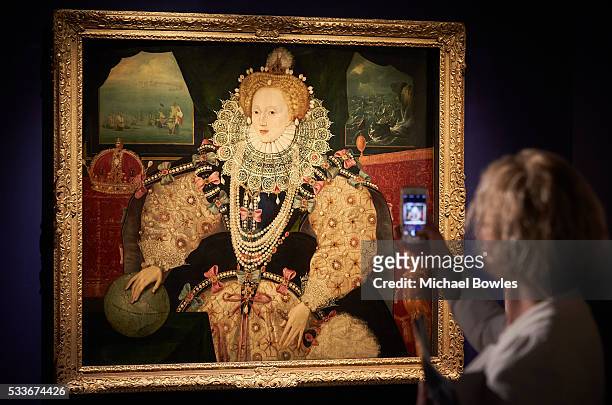 An observer captures an image on her smartphone of The Armada Portrait of Queen Elizabeth I as Art Fund and Royal Museums Greenwich launch public...