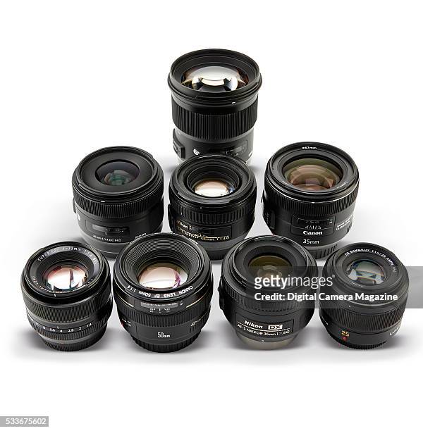 Selection standard prime lenses, including Canon, Nikon, Sigma, Panasonic and Fujifilm brands, taken on August 13, 2015.