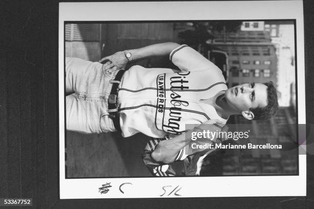 Model wearing reproduction baseball jersey of defunct minor league team, Pittsburgh Crawfords, manufactured by Ebbets Fields Flannels, selling at...