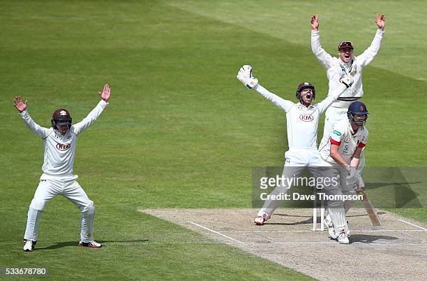 Surrey players appeal successfully for the wicket of Tom Smith of Lancashire who was given out LBW off the bowling of Gareth Batty of Surrey during...