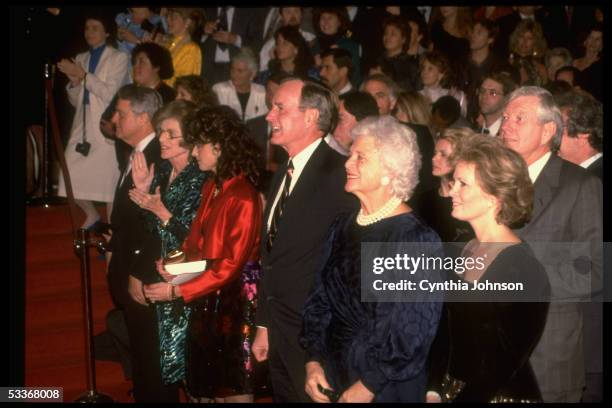 Unident., Barbara & VP Bush, Maria, Eunice & Sargent Shriver & behind Barbara, R. Davidson, at showing of "Twins" for Special Olympics.