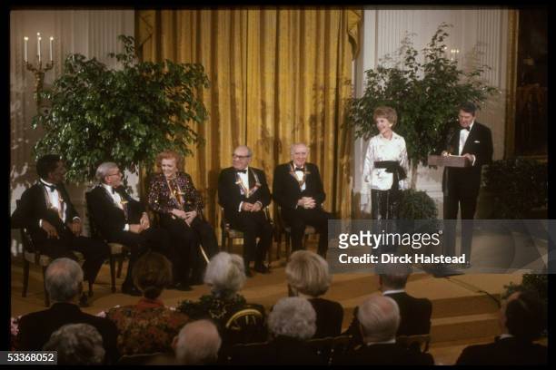 Former President Ron Reagan with wife Nancy & Kenndy Center honorees R.L. Stevens, A. Schneider, Myrna Loy, George Burns, & Alvin Ailey.