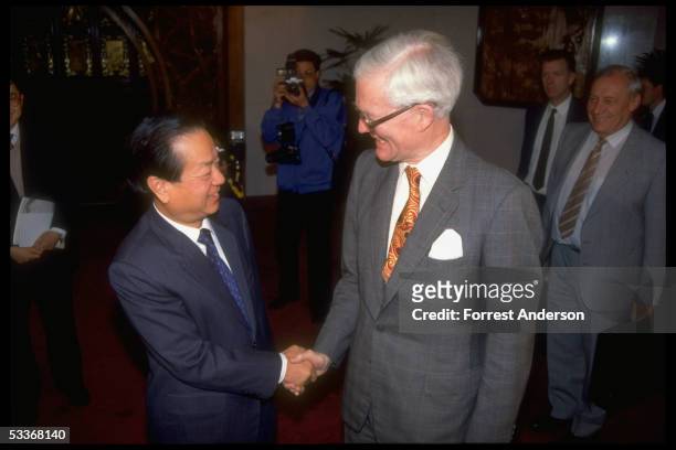 British Foreign Secretary Douglas Hurd shaking hands with Foreign Minister Qian Qichen during meetings re future of Hong Kong & Sino- British...