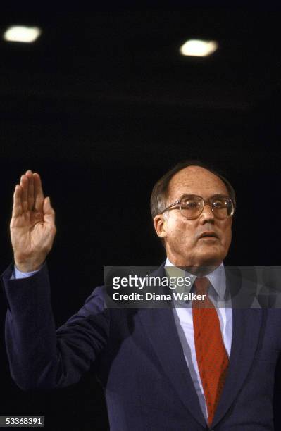 Chief Justice nominee William Rehnquist raising his hand while being sworn-in before Senate Judiciary Comm. For his confirmation hrg.