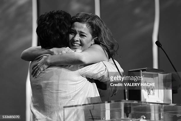 Filipino actress Jaclyn Jose hugs her daughter Filipino actress Andi Eigenmann after being awarded with the Best Actress prize during the closing...