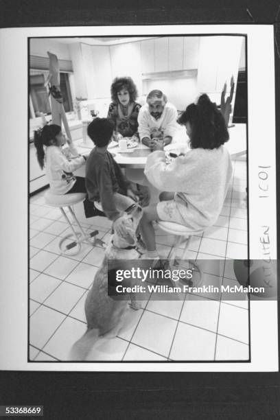 Neurologist Dr. Joel Saper founder of MI Head Pain Institute, with his wife Renee & kids Lauren, Justin & Lisa eating breakfast at kitchen table as...