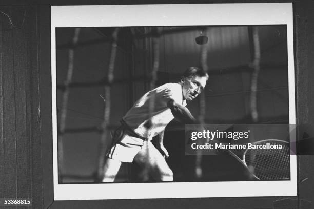 Author Gay Talese showing off his backhand as he strokes the ball while playing tennis at the Vertical Club.