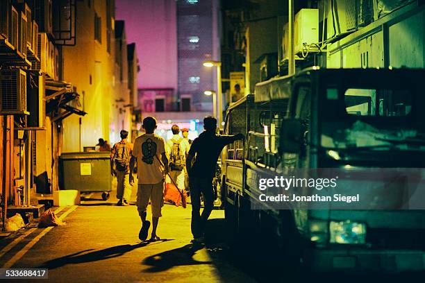 migrant workers - singapore alley stock pictures, royalty-free photos & images