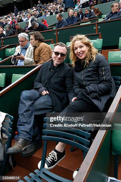 Actor Tim Roth and his wife Nikki Butler attend the 2016 French Tennis Open - Day Two at Roland Garros on May 23, 2016 in Paris, France.