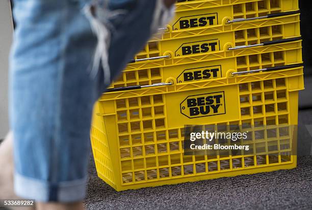 Shopper walks past baskets at a Best Buy Co. Store in San Francisco, California, U.S., on Thursday, May 19, 2016. Best Buy Co. Is scheduled to...