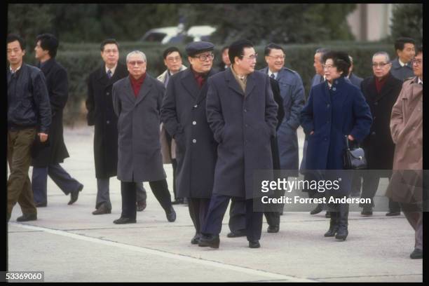 Li Peng & wife , Communist Party General Secretary Jiang Zemin , outside, heading entourage during Li's departure on Asian tour.