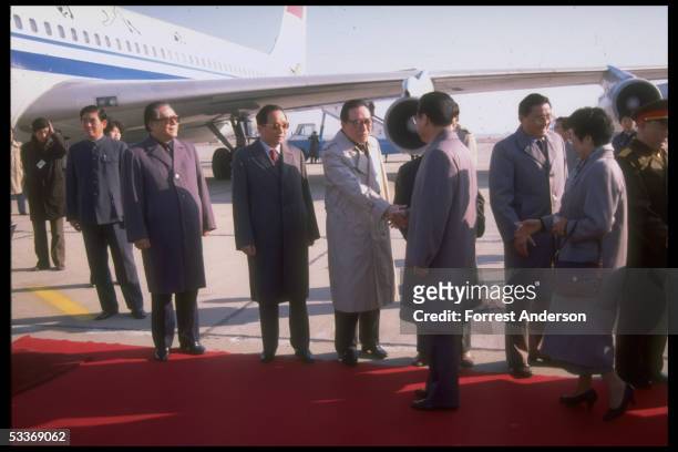 Li Peng & wife , shaking hands, bidding farewell to leaders including Communist Party General Secretary Jiang Zemin , in red carpet airport departure...