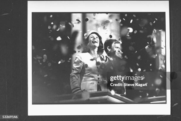 Dan Quayle waving to crowd as his wife Marilyn beams amidst blizzard of confetti after making speech at the Republican National Convention in the...