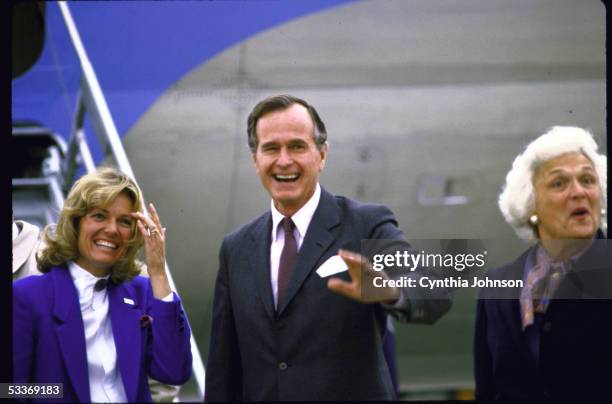 Vice President George Bush with wife Barbara and cong. Candidate Jill Emery , at airport.