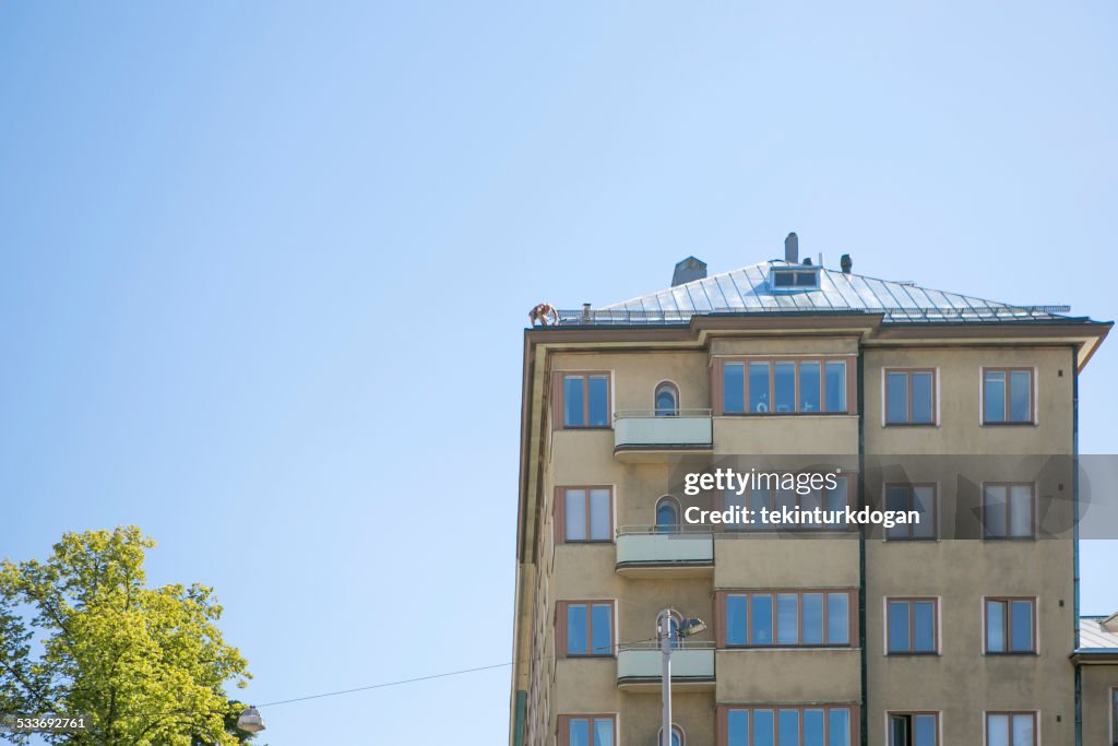 Person working on the roof  at helsinki finland