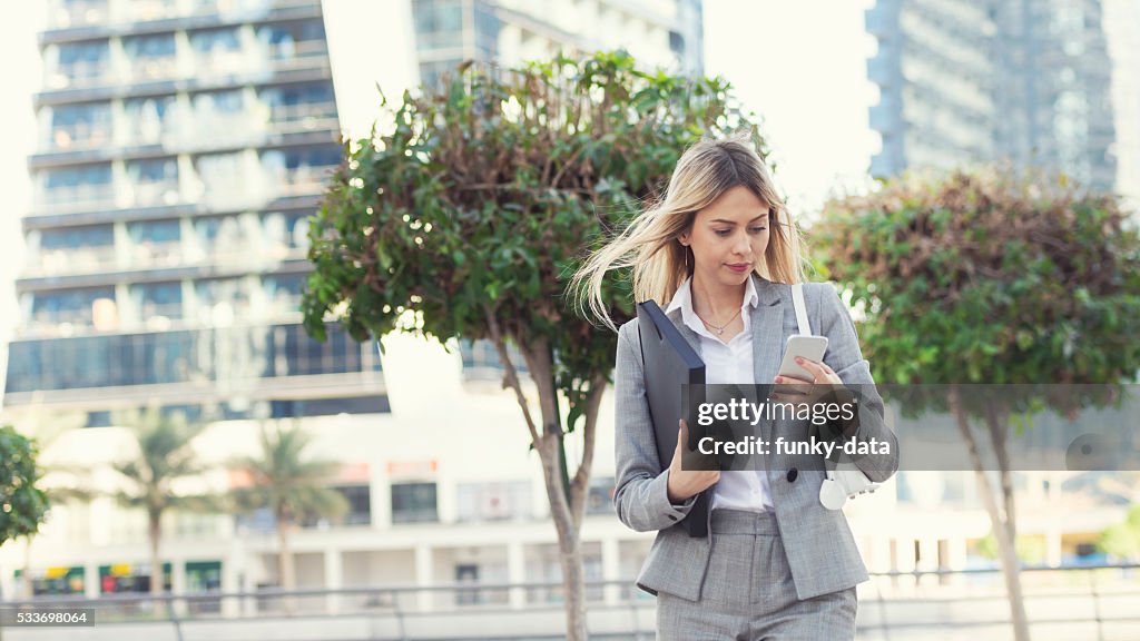 Businesswoman texting in Dubai