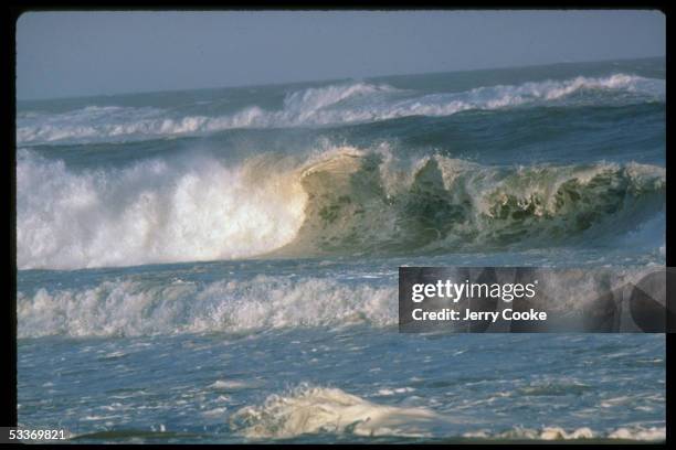 Wonderful of waves crashing to shore of unidentified beach.