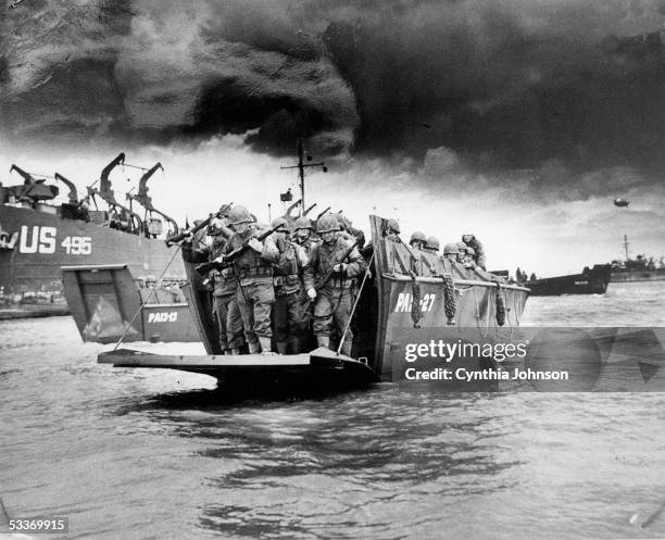 Copy print of American soldiers disembarking from an LCI landing craft upon its arrival on the beaches of Normandy for Operation Overlord, aka the...