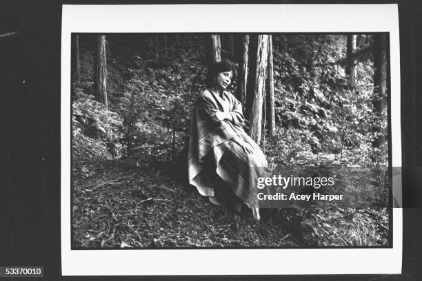 Author Isabel Allende posing in redwood grove where she goes to meditate.