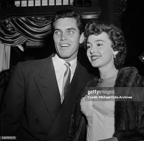 Actress Barbara Rush and husband Jeffrey Hunter attend a movie premiere in Los Angeles,CA.