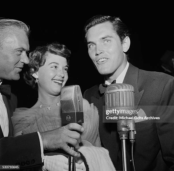 Actress Barbara Rush and husband Jeffrey Hunter attend a movie premiere of "The Robe" in Los Angeles,CA.