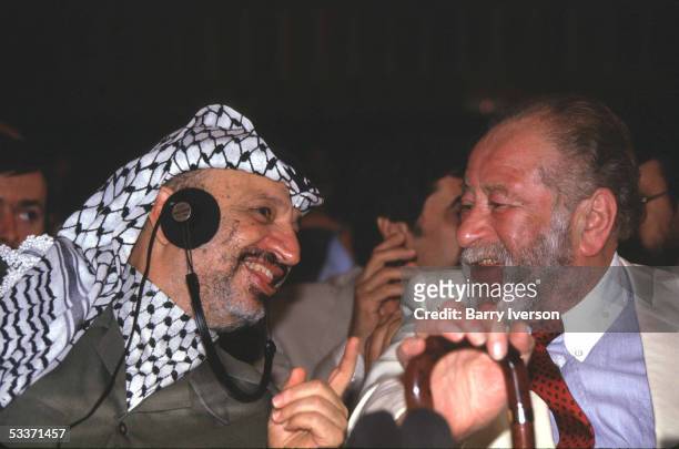 Palestine Liberation Organization leader Yasser Arafat speaking with Austrian Chancellor Bruno Kreisky during a meeting of the Palestinian National...